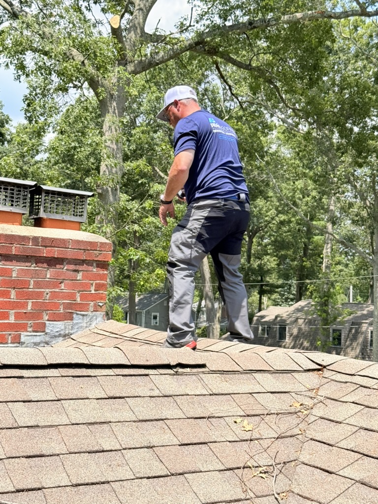Peak Exteriors roof inspection near chimney